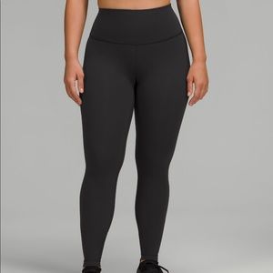 Size 4 black Wunder Under HR Tight 28”. High waisted.